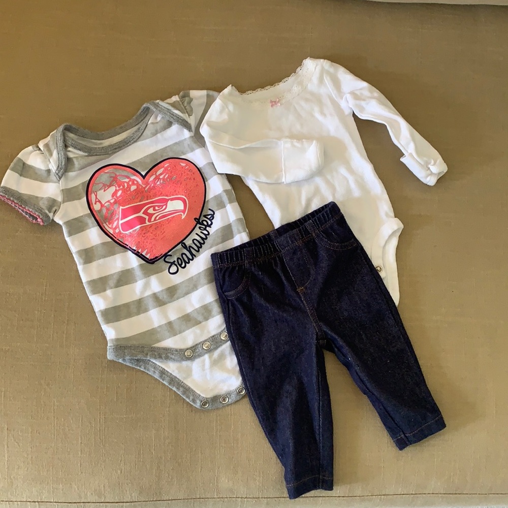 Baby girl clothes including Seahawks onesie